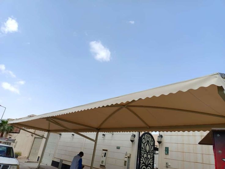 تنفيذ مظلات قماش كوري